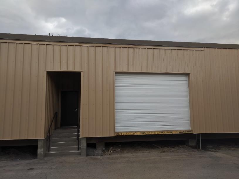 closer image of entry way and right garage door 