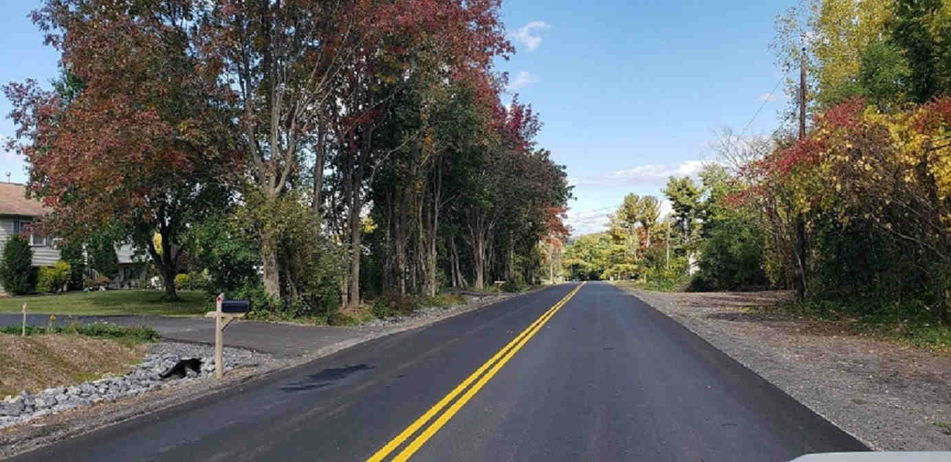 road image in fall with trees trimmed