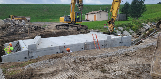 four concrete boxes aligned to form bridge with opening boxes on each end